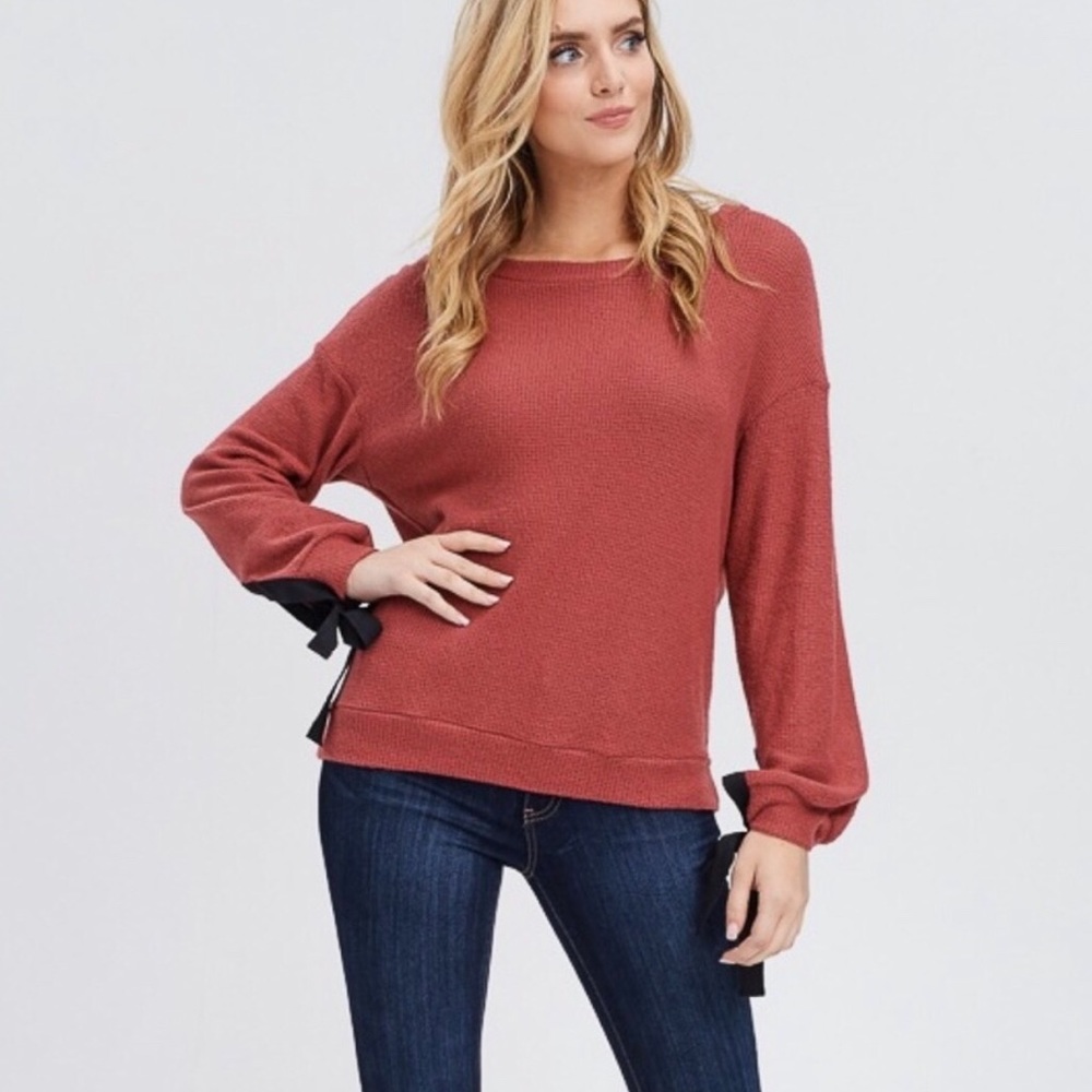 Soft textured top with cute ribbon sleeve tie